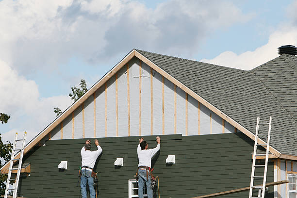 Professional Siding Contractor technician working in Cable, OH